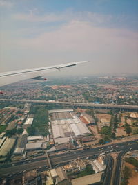 Aerial view of cityscape against sky