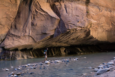 People working on rock at beach