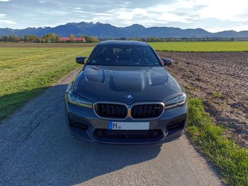 Car on road amidst field