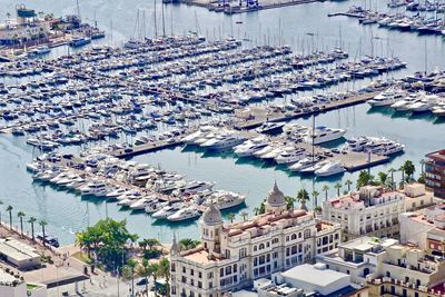 High angle view of harbor by buildings in city