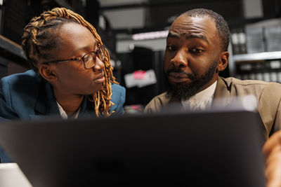 Young woman using laptop at office