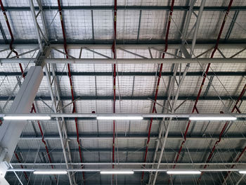 Low angle view of illuminated warehouse structure