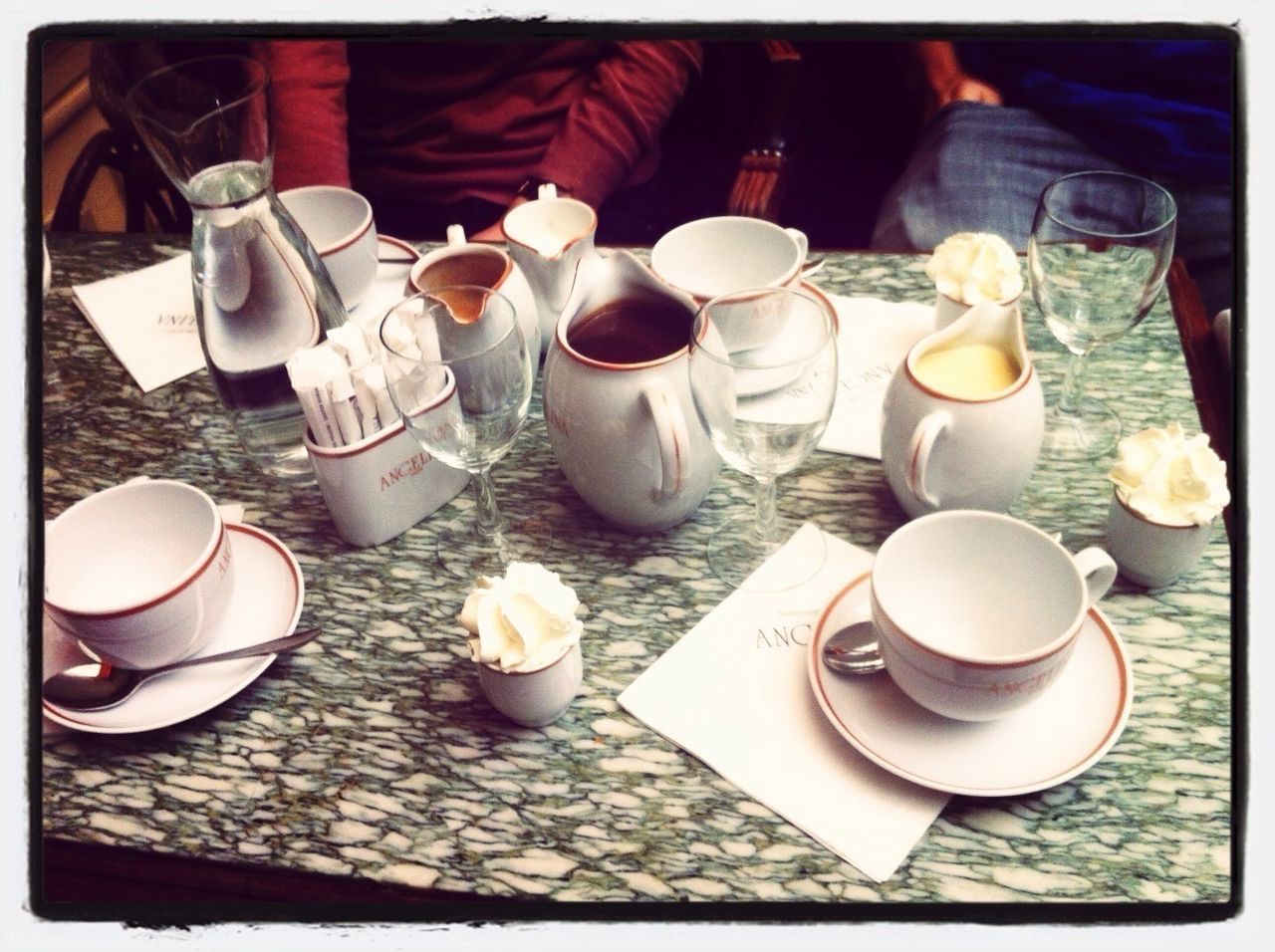 transfer print, auto post production filter, coffee cup, food and drink, drink, table, indoors, coffee - drink, refreshment, high angle view, person, chair, cup, saucer, freshness, day, coffee, spoon, lifestyles