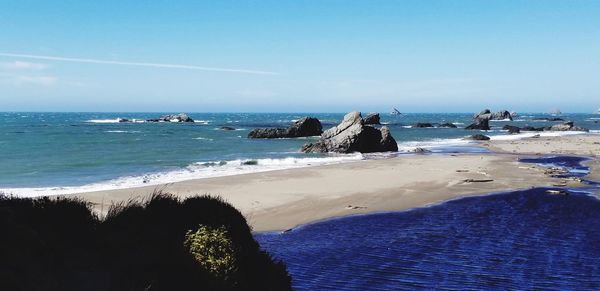 Scenic view of beach against sky