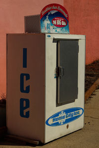 Close-up of information sign on wall