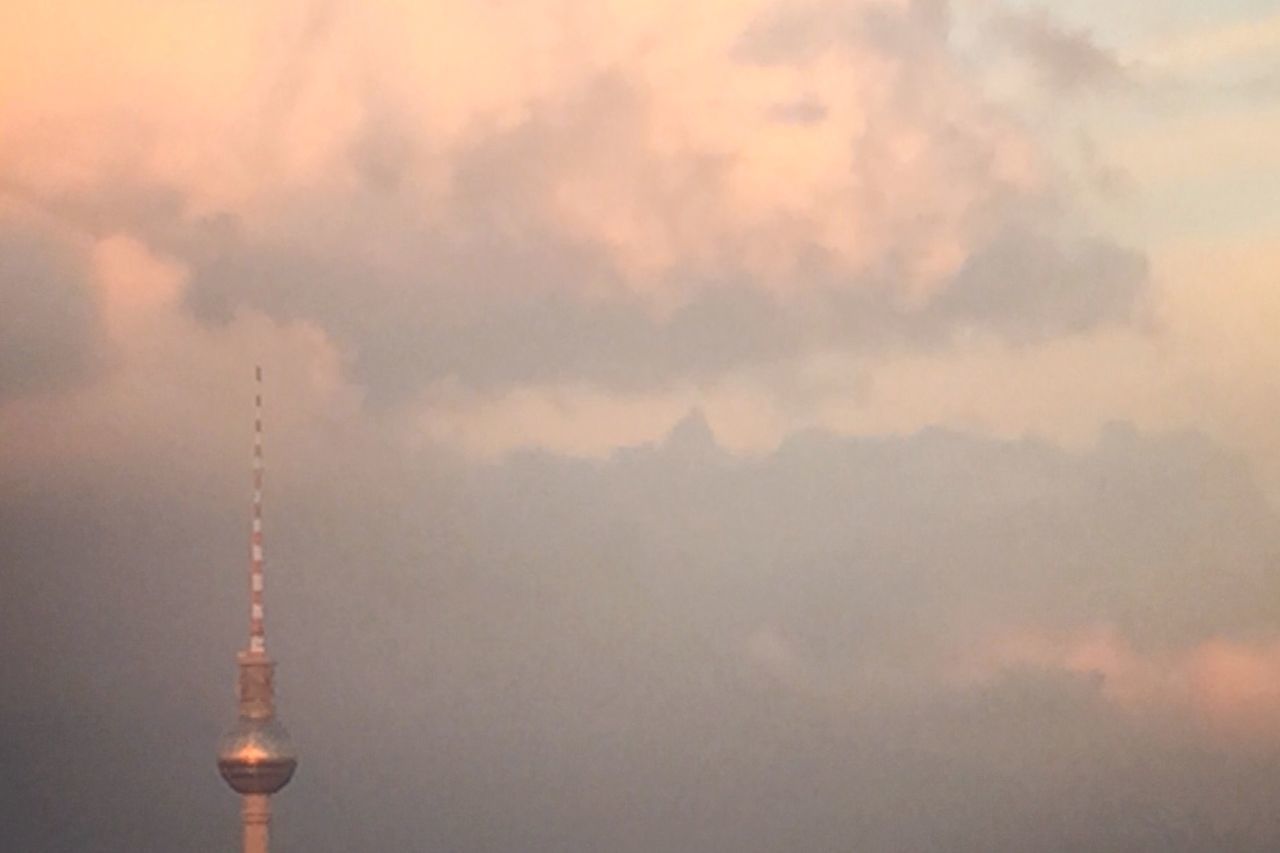 communications tower, tower, tall - high, sky, built structure, international landmark, architecture, famous place, low angle view, travel destinations, communication, tourism, building exterior, cloud - sky, capital cities, spire, city, travel, fernsehturm, television tower