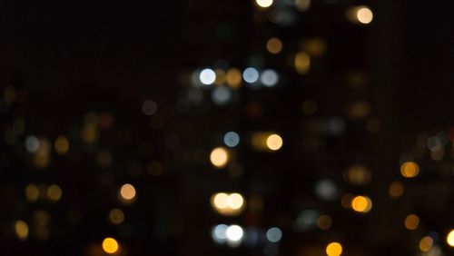 Defocused image of illuminated lights at night