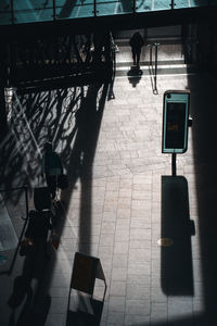 High angle view of people walking on footpath