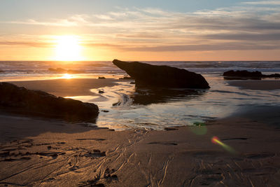 Scenic view of sea against sky during sunset