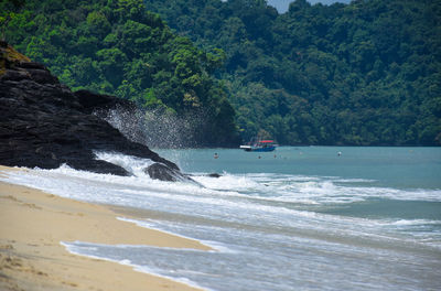 Scenic view of sea against mountain