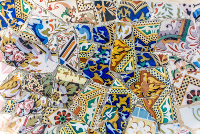 Tile mosaics fragment of serpentine bench in park guell in barcelona