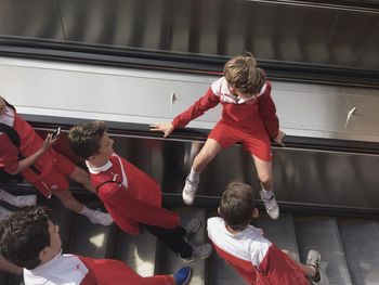 FULL LENGTH OF GIRL STANDING IN RED UMBRELLA