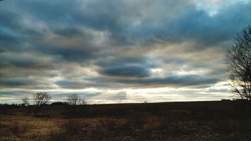 Scenic view of landscape against cloudy sky