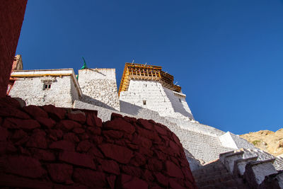 Low angle view of building against blue sky