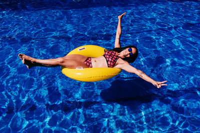 High angle view of woman swimming in pool