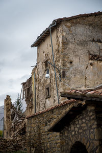 Low angle view of old building against sky