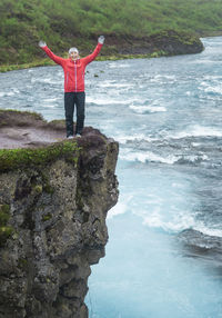 Full length of man standing on rock