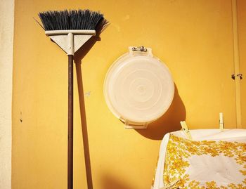 Low angle view of electric lamp hanging on wall