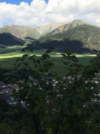 Scenic view of landscape and mountains against sky