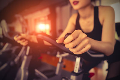 Midsection of woman exercising in gym