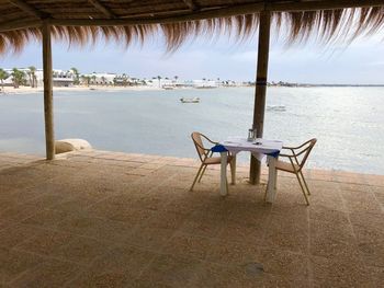 Chairs on table at beach