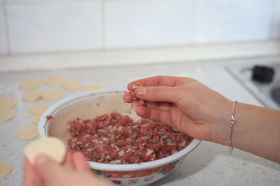 Midsection of woman preparing food