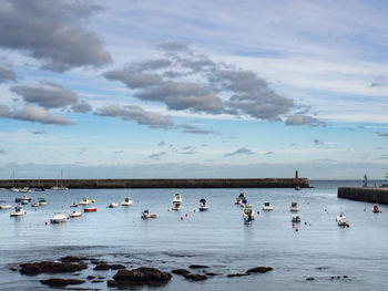 Boats on beach against sky