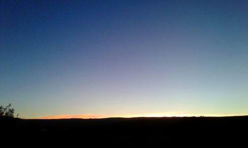 Scenic view of silhouette landscape against clear sky
