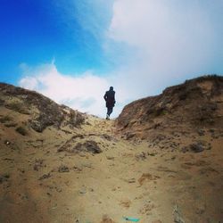 Full length of people on mountain against clear sky