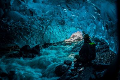 Man in cave during winter