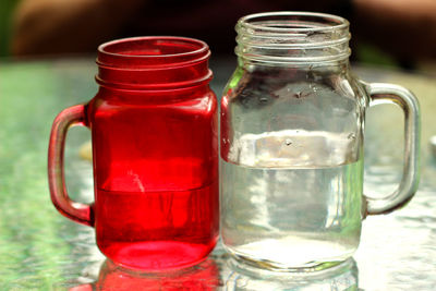 Close-up of drink in glass jar on table