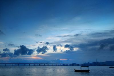 Scenic view of sea against cloudy sky