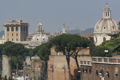 Panoramic view of buildings in city against sky