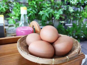 Close-up of eggs in basket on table