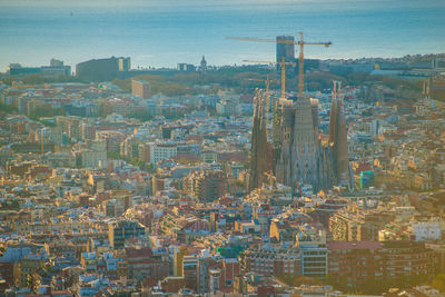 High angle view of buildings in city against sky