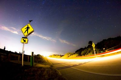 Road against sky at night