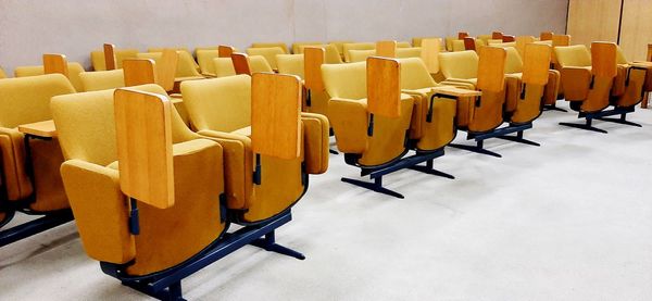 High angle view of empty chairs and table