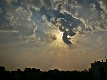 Low angle view of built structure against sunset