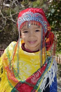 Portrait of smiling girl in traditional clothing