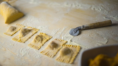 Cropped image of woman preparing food on table