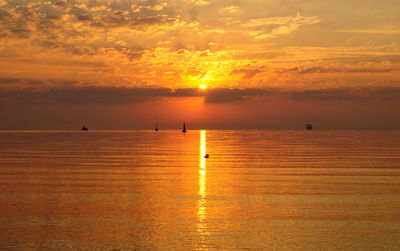 Scenic view of sunset over calm sea