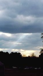 Scenic view of landscape against cloudy sky