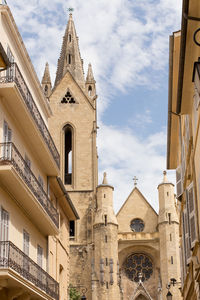 Exterior of historic church against blue sky