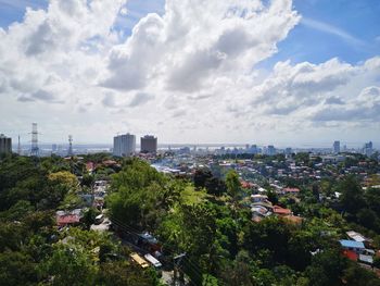 High angle view of trees and buildings against sky