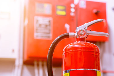 Close-up of red fire extinguishers