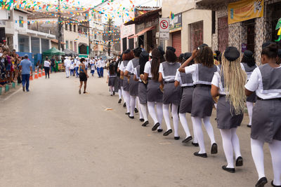 Members of cheganca de mouros barra nova feminina parading in line at the chegancas cultural meeting