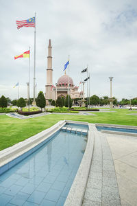 View of swimming pool in building against sky