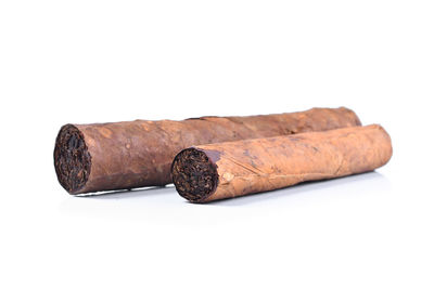 Close-up of cigarette against white background