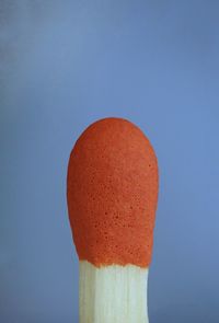 Close-up of orange against blue background