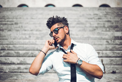 Portrait of young man wearing sunglasses